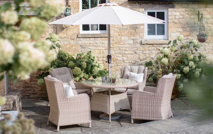 Bramblecrest Chedworth 4 Seat Round Rattan Garden Dining Set with Parasol & Base - Sandstone